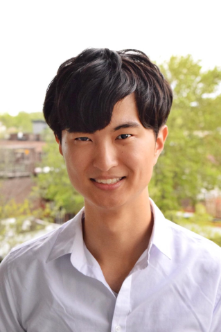 man wearing white shirt in outdoor setting