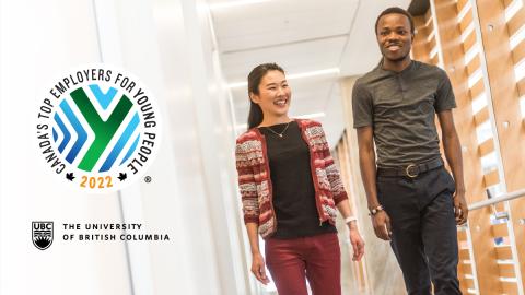 Postdoctoral fellows walking in a hallway.