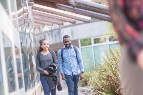 Girl and boy walking together and talking