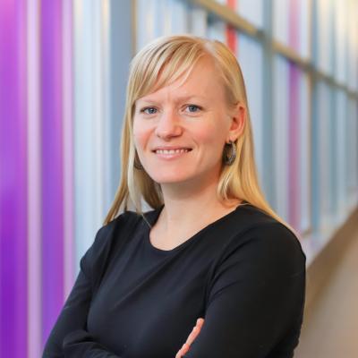 Laura Schummers standing in a hallway