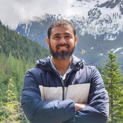 Headshot of Dr. Md Mahamud ur Rashid with mountains in the back