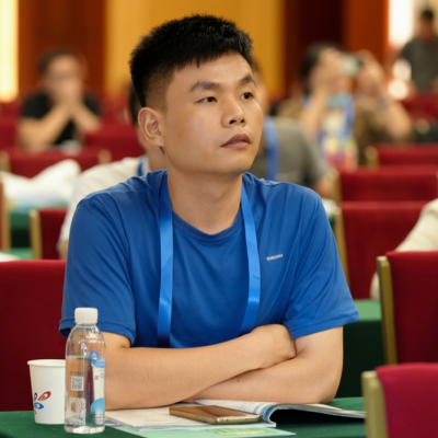 Asian man sitting at a table